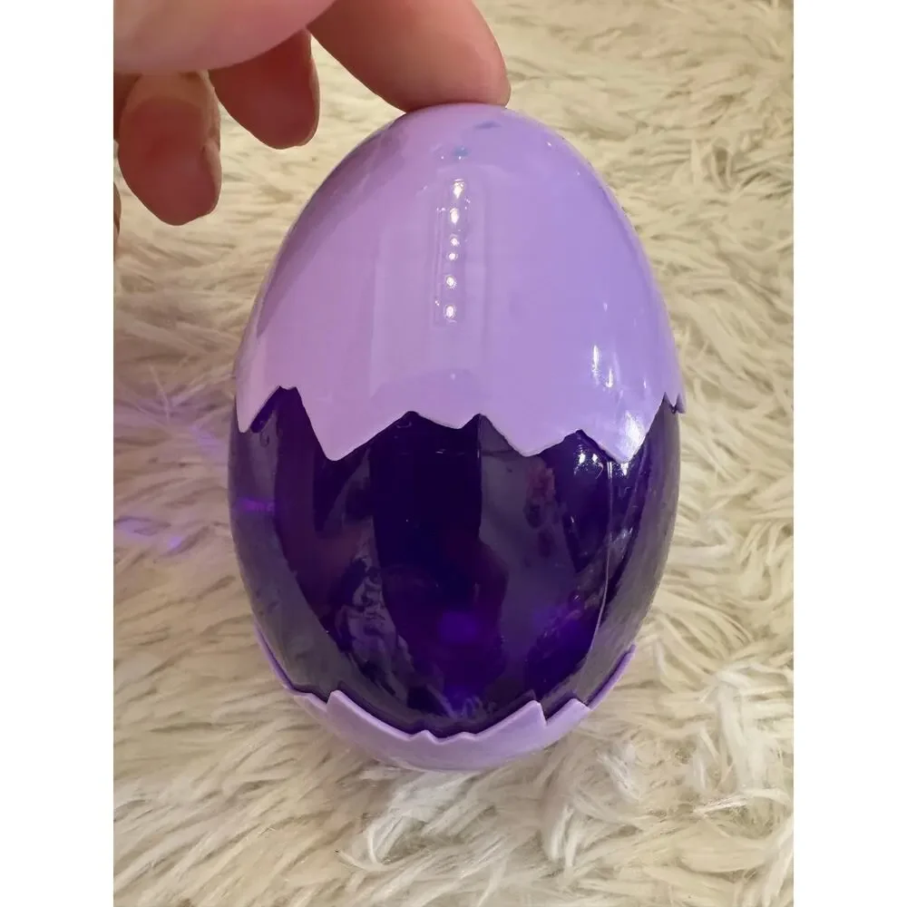 Purple slime dinosaur egg with an assorted dinosaurs inside